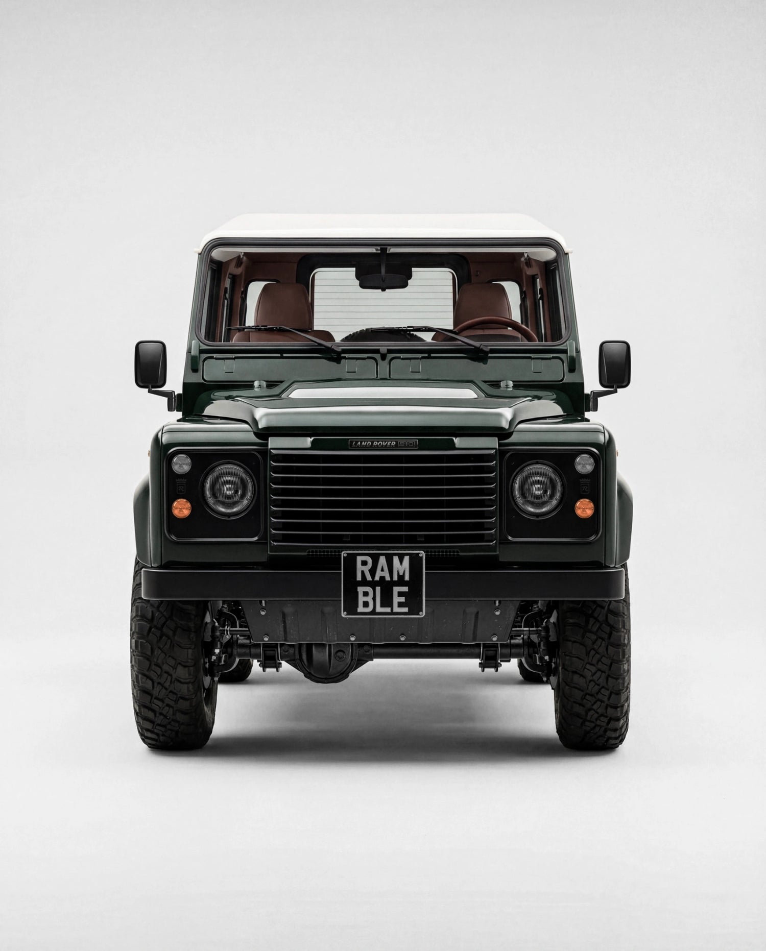 FRONT VIEW WITH CLASSIC DEFENDER GRILL AND LIGHTS